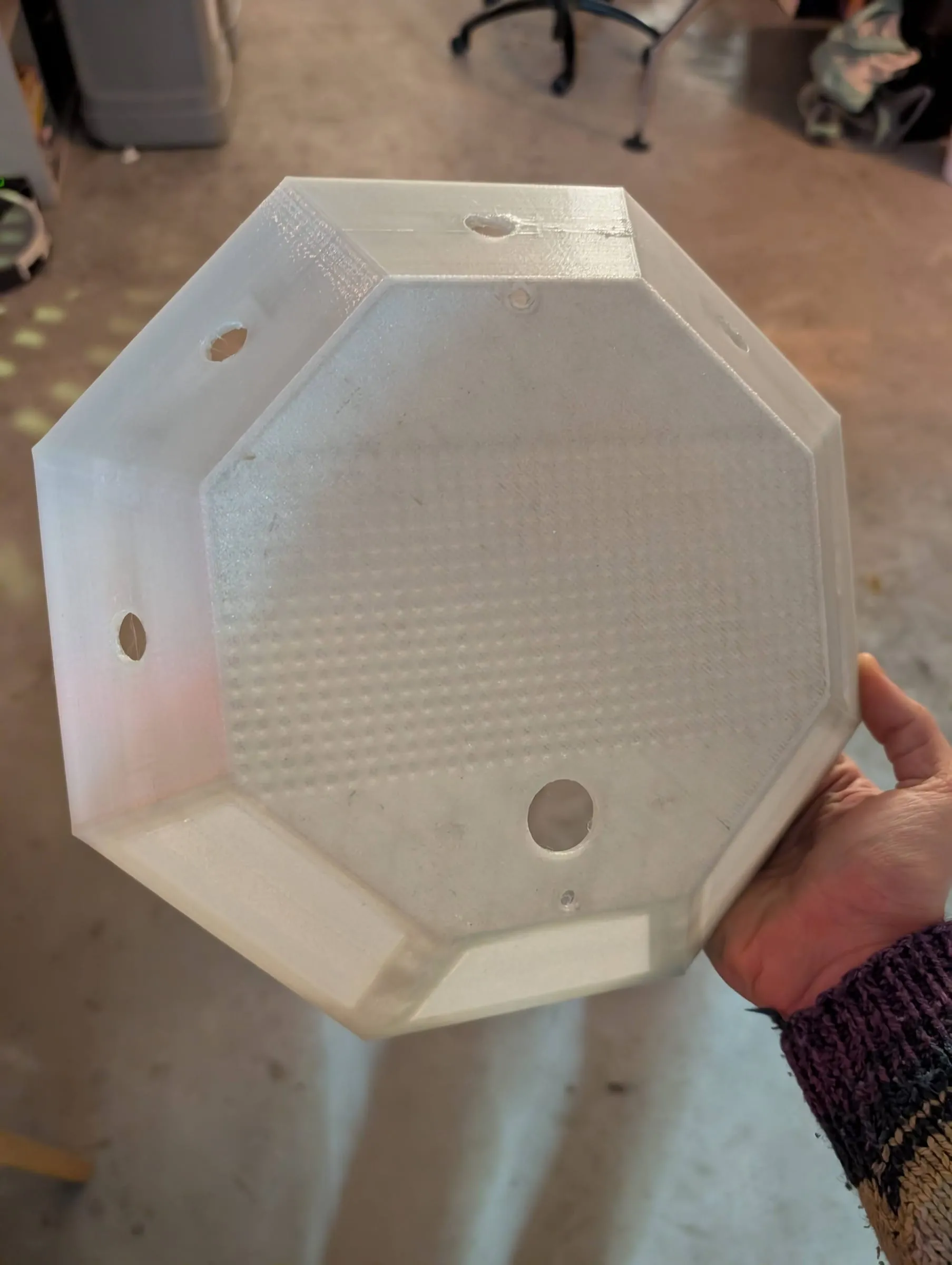 The finished translucent diffuser held in one hand