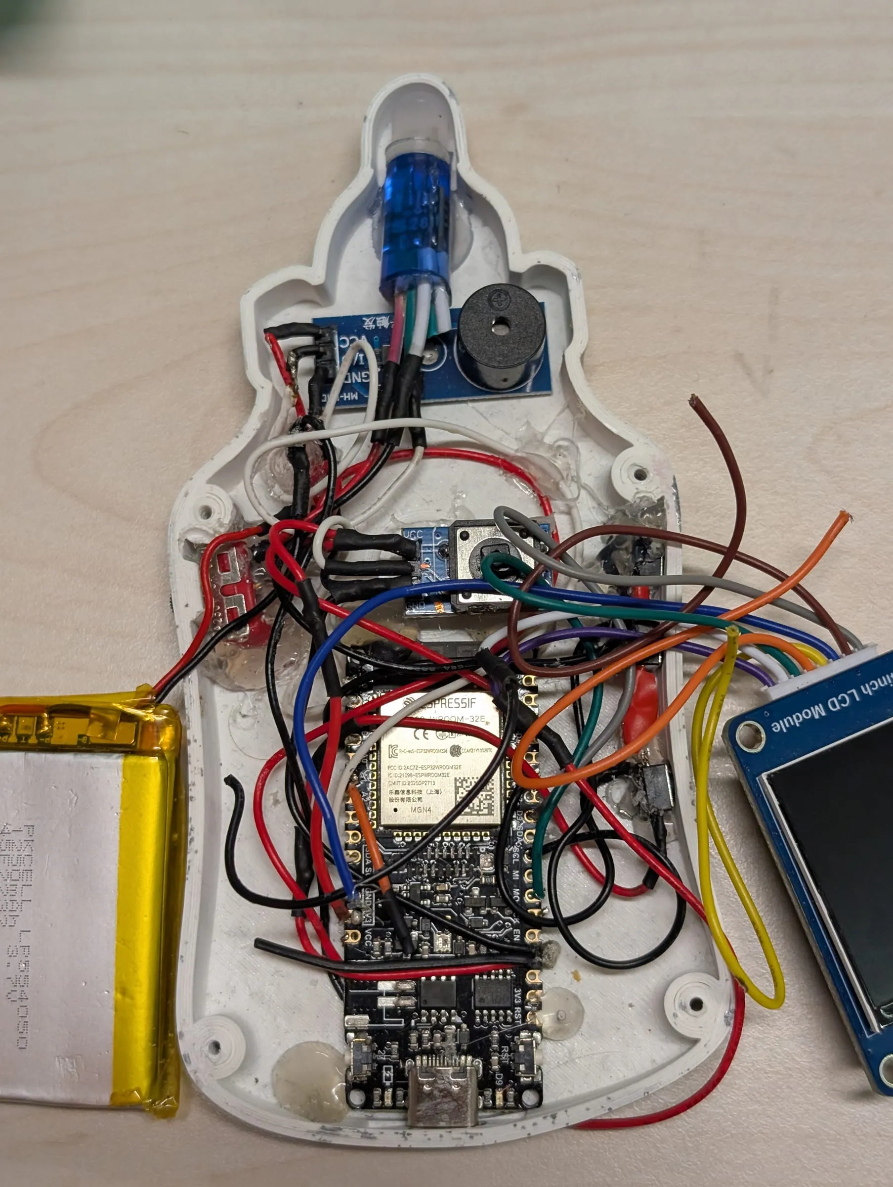 The internals, wired and packed into the shell