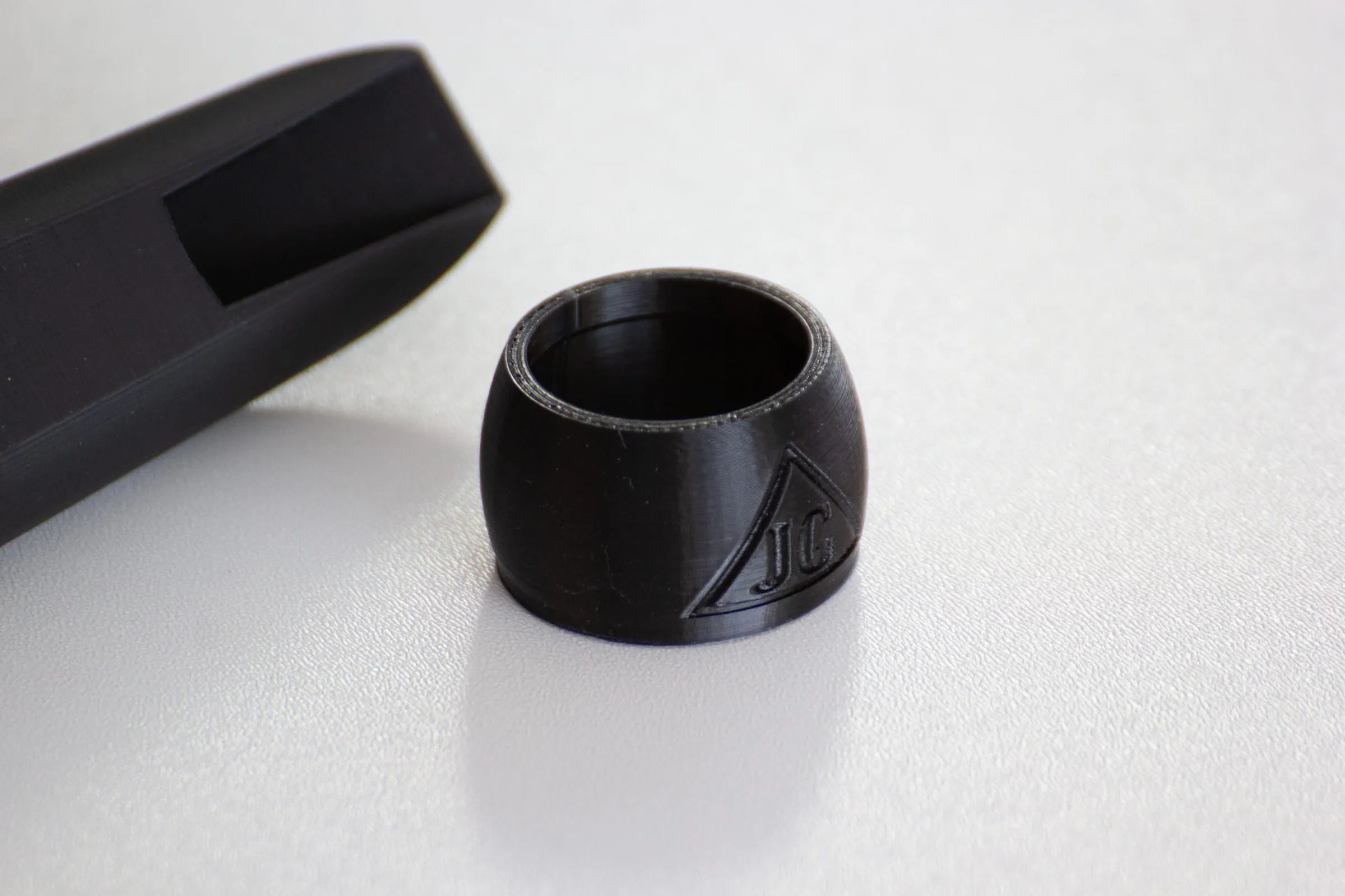 A finished ligature, showing the surface finish and branding