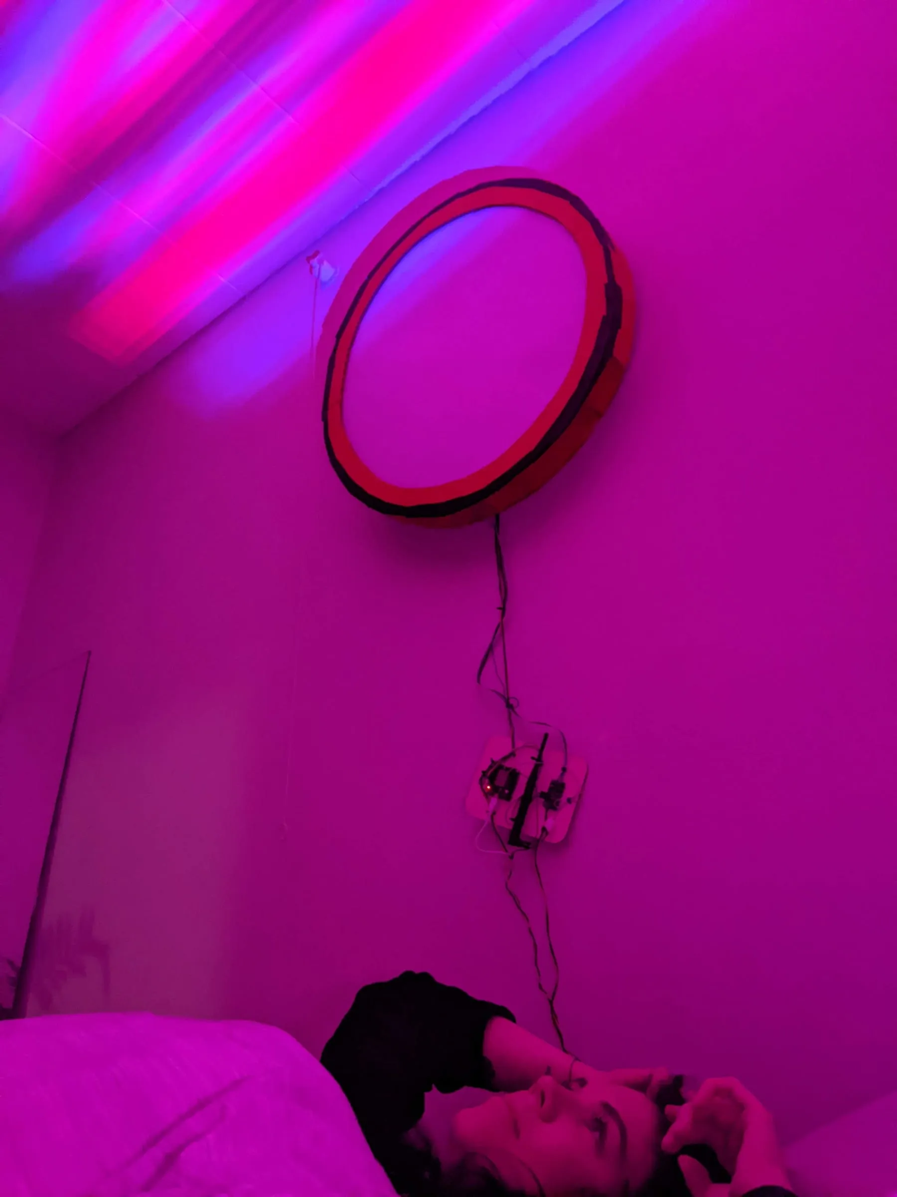 A ring prototype mounted on a bedroom wall