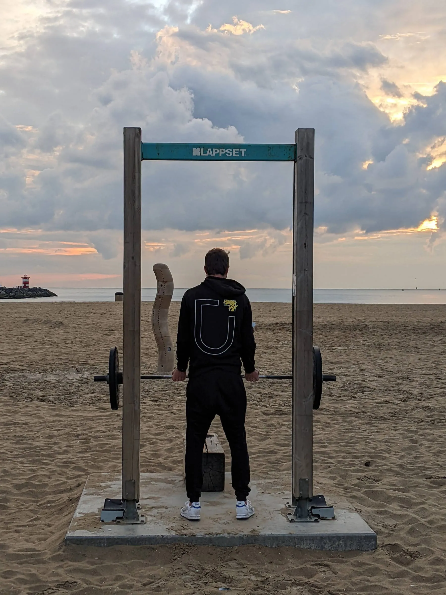 The Wave standing among the outdoor gym equipment on the sports beach